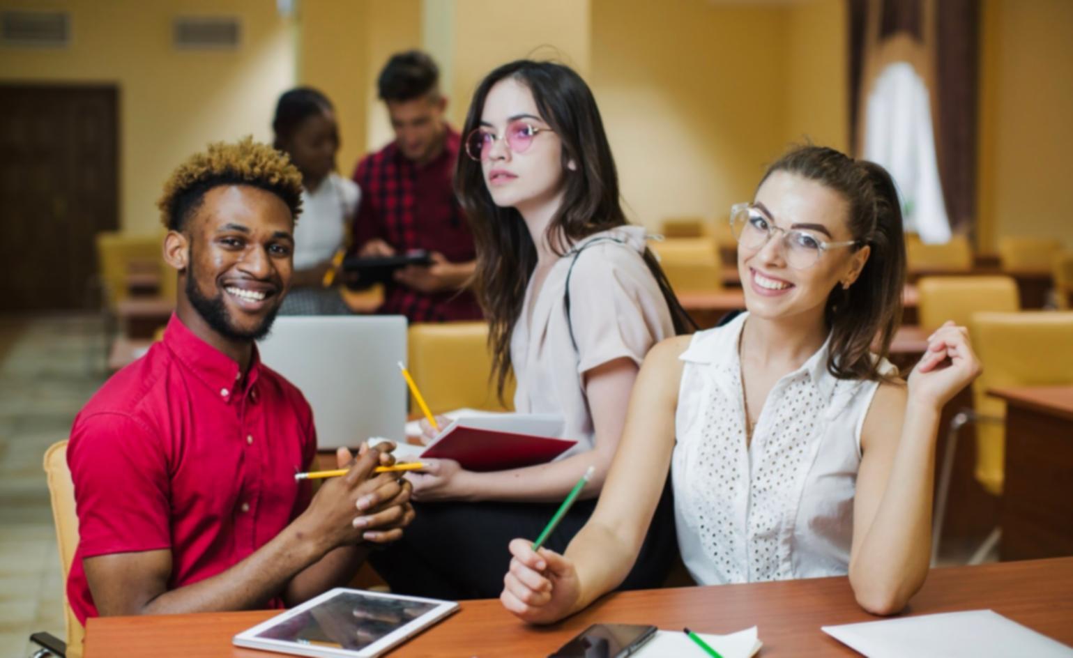 Students engaged in collaborative financial analysis workshop